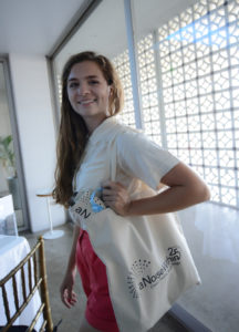 ANW Box Office’s Savannah Gilmore shows off our new ANW tote bags featuring an Angela Balogh Calin costume sketch on the back! Photo by Shawn Harris.